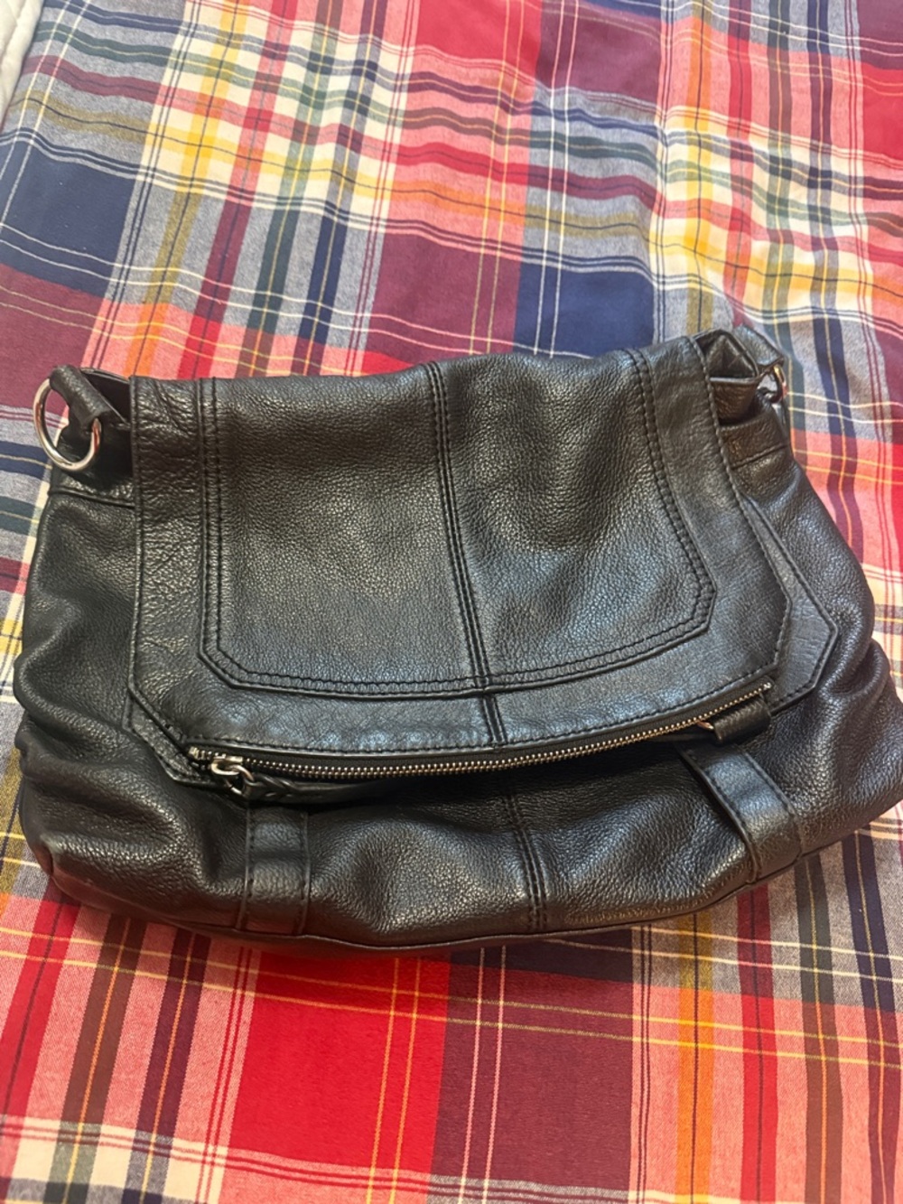 The Sak Black Leather Messenger Bag with Printed Interior needs a long strap